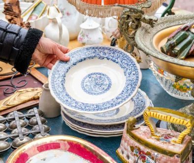 Hand of person holding a plate at an estate sale